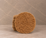 Stack of NEEMSAJ natural handmade coir bath scrubber pads