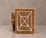 Stack of stitched natural coir kitchen scrubber pads